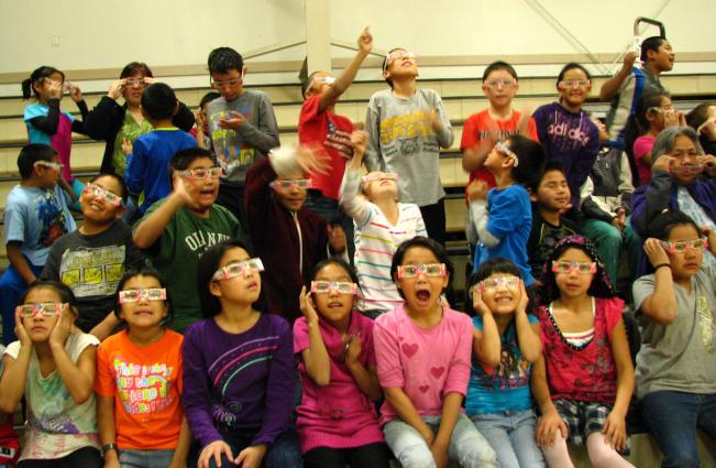 Alaskan students wearing defration glasses